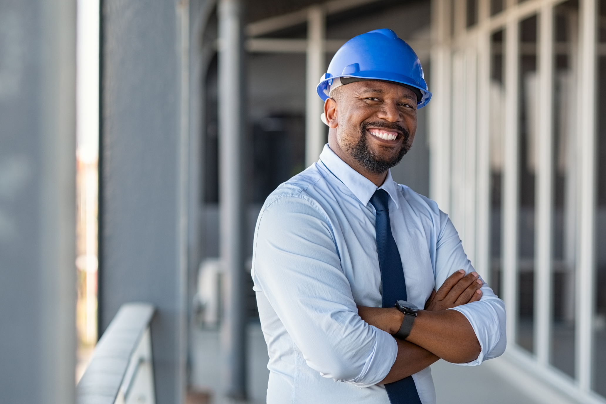 Smiling Contractor at Building Site